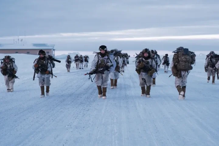 Soldiers of the 11th Airborne Division in white winter camouflage march along a snow-covered road near Utqiagvik, Alaska, during a 2024 exercise (file photo)