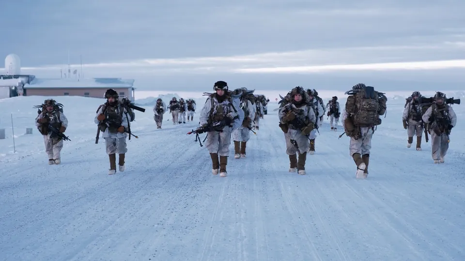 Soldiers of the 11th Airborne Division in white winter camouflage march along a snow-covered road near Utqiagvik, Alaska, during a 2024 exercise (file photo)