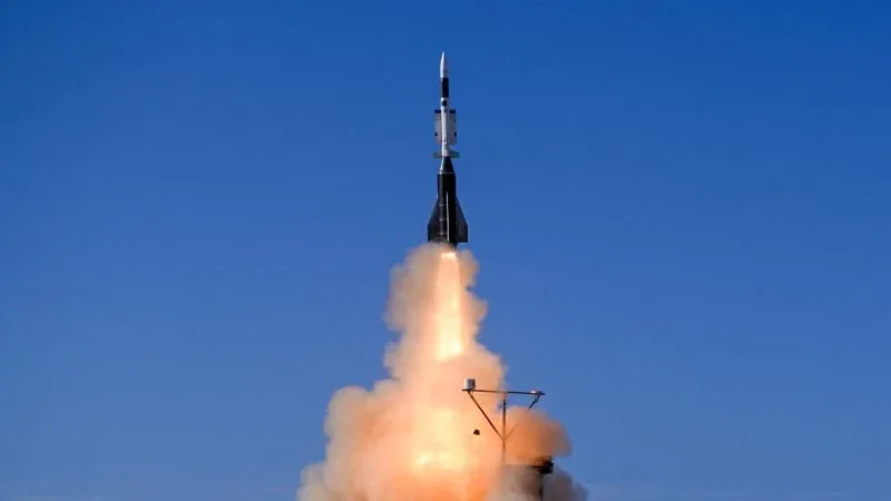 An Aster 30 B1NT missile climbing on a column of smoke and flame against a blue sky during the first qualification firing at Biscarrosse, France