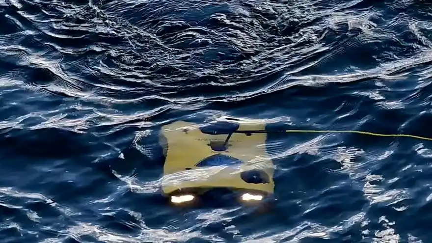A remotely operated underwater vehicle at the sea surface during an earlier AUKUS Pillar II event