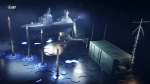 Interceptor missiles of IAI’s Barak MX family in front of a ground launcher and a warship