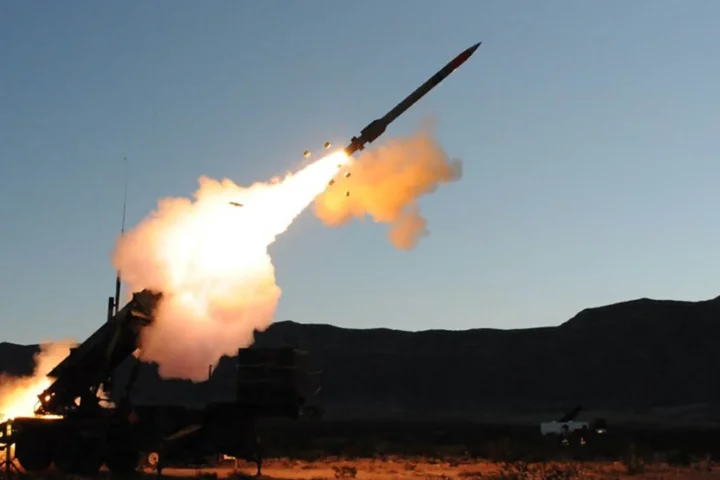 PAC-3 interceptor launches from a Patriot launcher during an interception test at dusk, archive photograph