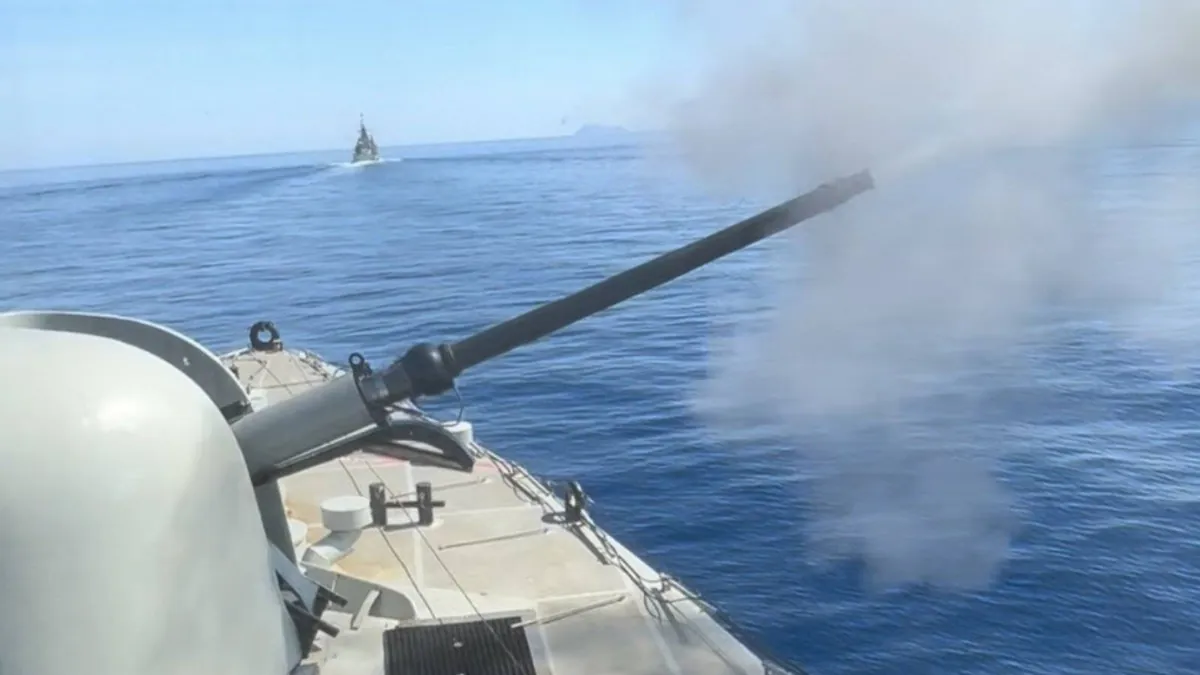 A Hellenic Navy gunboat firing its main gun during exercise BRONTI 2/26