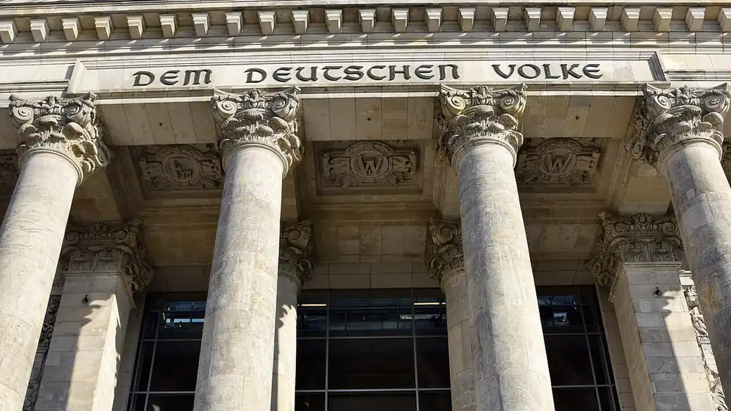 Columns and the inscription Dem Deutschen Volke on the front of the Reichstag building in Berlin, seat of the Bundestag