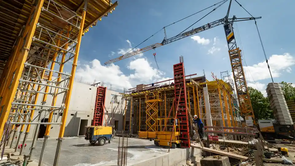 Construction site with scaffolding and a crane at the new energy centre of the Bundeswehr Central Hospital in Koblenz