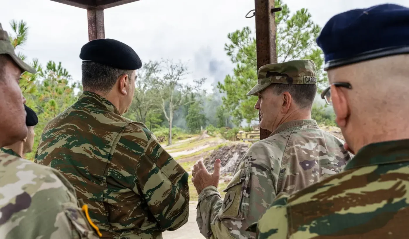 Greek Brigadier General Paschalis Filousis speaking with Maj. Gen. Robert Carruthers of the Florida Army National Guard at a training area of Camp Blanding