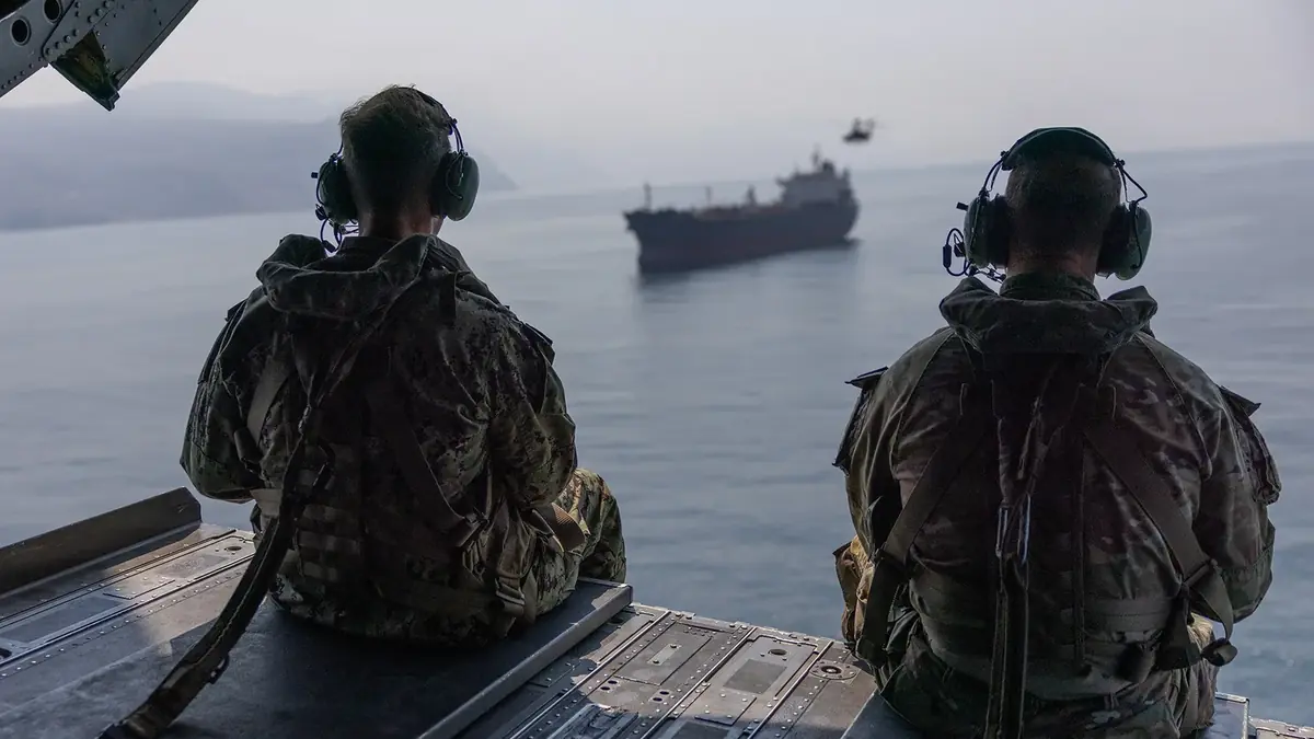 CENTCOM commander Adm. Brad Cooper and Brig. Gen. Brandon Tegtmeier of the 82nd Airborne Division watch commercial traffic in the Strait of Hormuz from a CH-47 Chinook, October 25, 2026