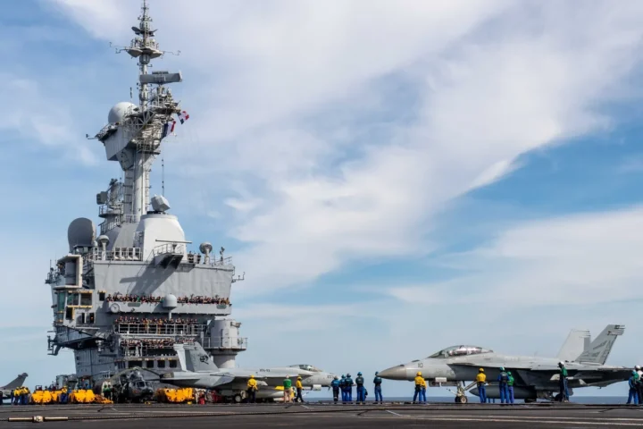 US F/A-18E/F Super Hornets moving beside the island of the French carrier Charles de Gaulle during Pacific Steller 2025