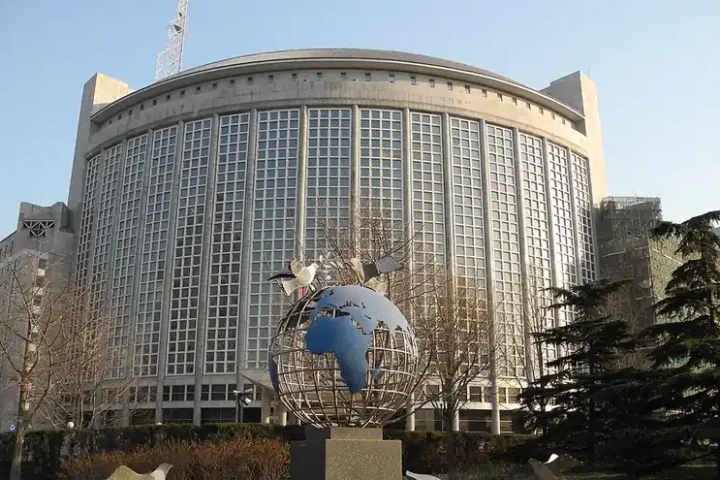 The headquarters building of China's Ministry of Foreign Affairs in Beijing, with a globe sculpture in front