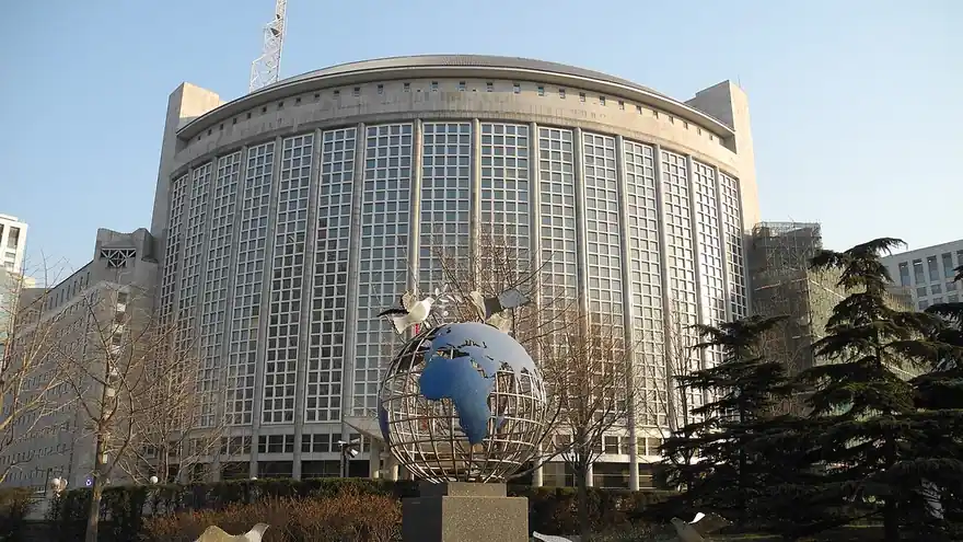 The headquarters building of China's Ministry of Foreign Affairs in Beijing, with a globe sculpture in front
