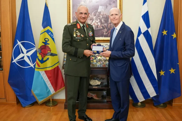 Two men shaking hands in an office at the Hellenic National Defence General Staff