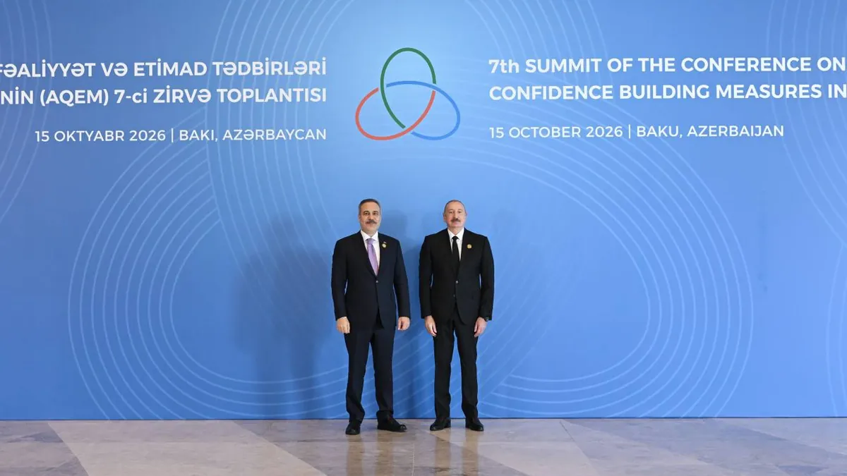 President Ilham Aliyev with an arriving delegate in front of the backdrop of the 7th CICA summit in Baku, 15 October 2026