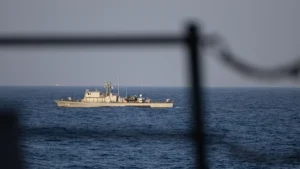 The Cyprus Navy offshore patrol vessel P61 sailing on the open sea, seen from the deck of the US destroyer USS Oscar Austin