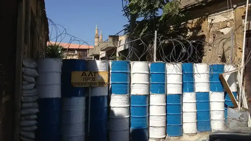 Barrels and barbed wire in the UN buffer zone in the old city of Nicosia