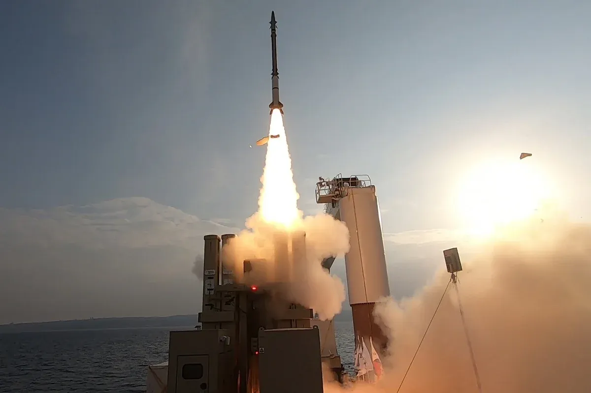 A David’s Sling interceptor missile launching in a cloud of smoke during an interception test in Israel