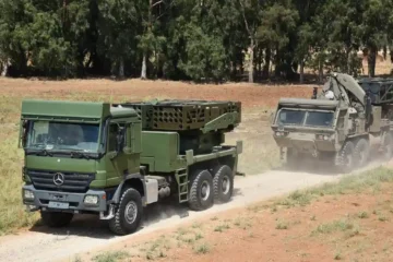 Elbit Systems PULS rocket launchers on trucks, on a dirt track