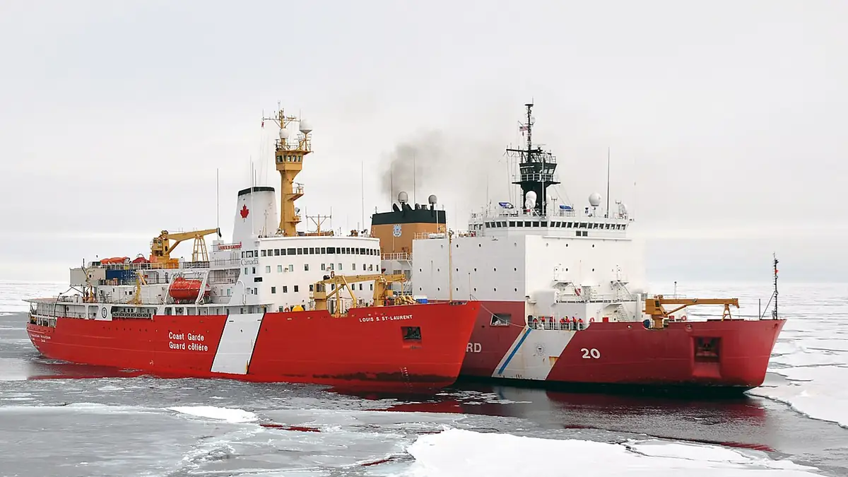 Two icebreakers moored together in Arctic waters, the Canadian Louis S. St-Laurent and the U.S. Coast Guard cutter Healy