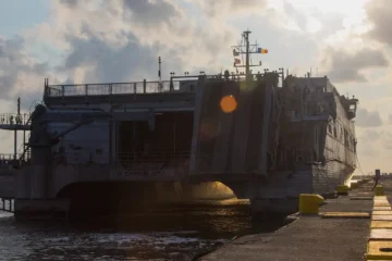 A U.S. Navy expeditionary fast transport vessel moored at a quay in the Romanian Black Sea port of Constanta