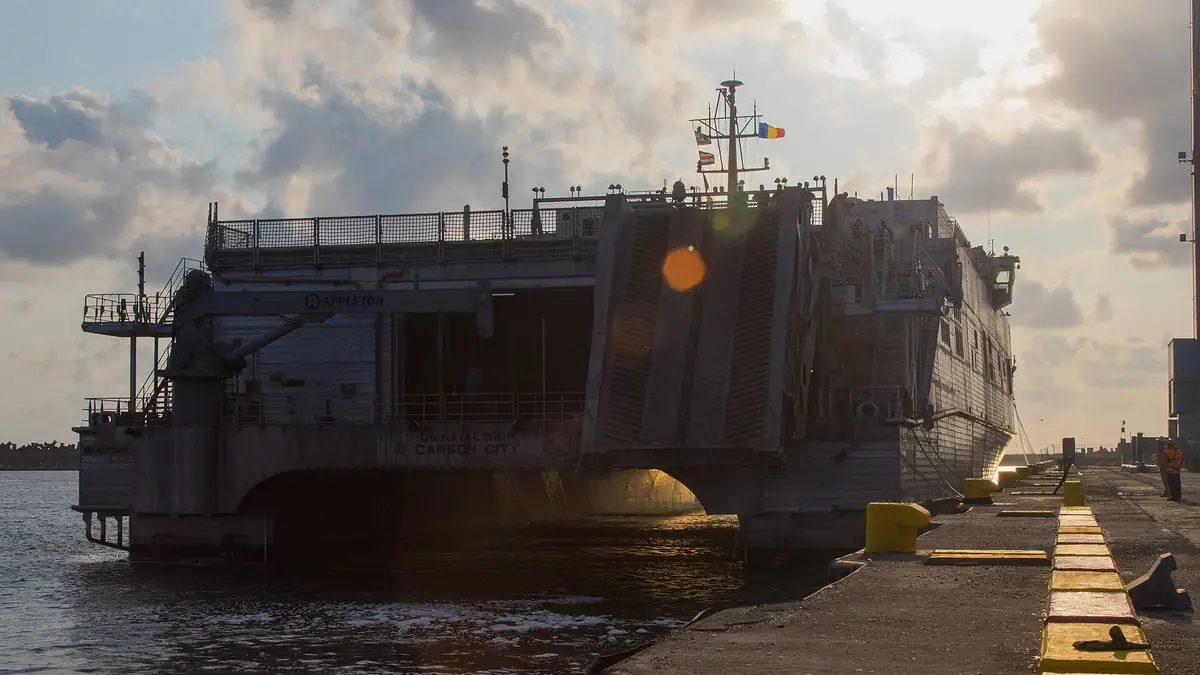 A U.S. Navy expeditionary fast transport vessel moored at a quay in the Romanian Black Sea port of Constanta