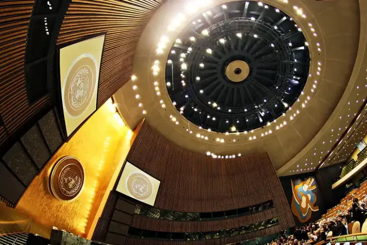 Interior of the United Nations General Assembly Hall in New York with the UN emblem and the domed ceiling