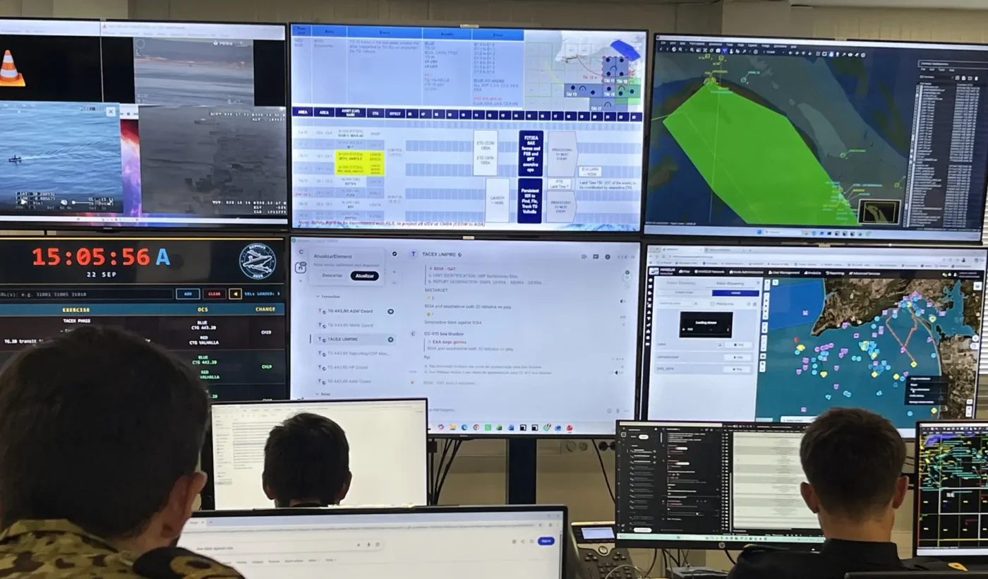 Personnel monitor maritime activity in the REPMUS control room in Portugal, with the MARSUR display visible.