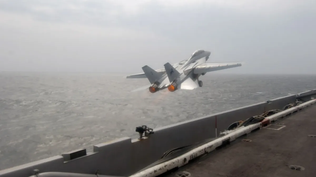 An F-14D Tomcat of VF-213 launching from USS Theodore Roosevelt