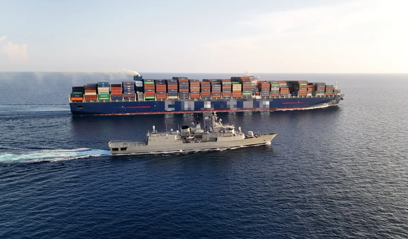 The Greek frigate Spetsai (F-453) escorting a merchant ship during EUNAVFOR ASPIDES