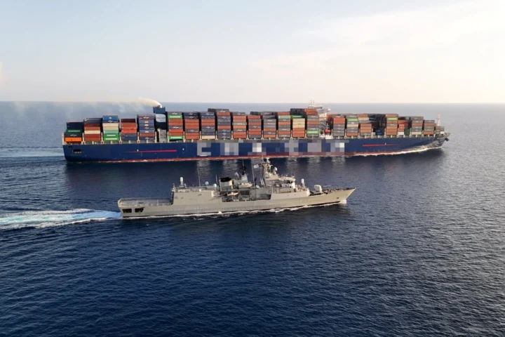 The Greek frigate Spetsai (F-453) escorting a merchant ship during EUNAVFOR ASPIDES