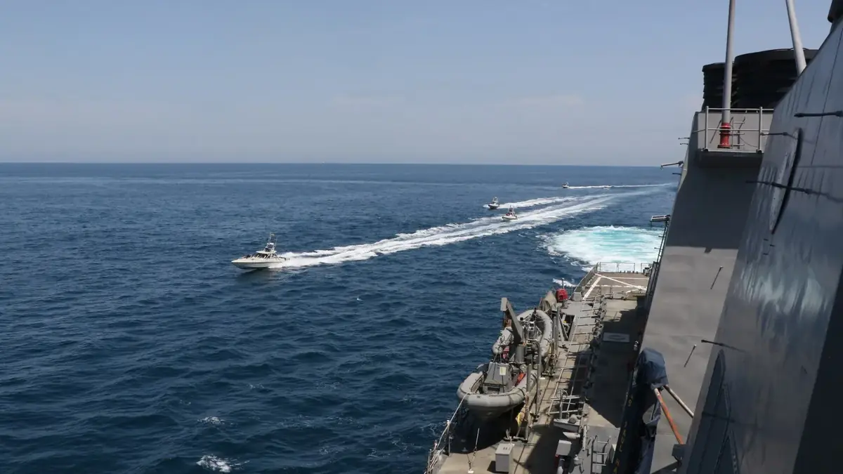 IRGC Navy fast boats near a US destroyer in the northern Persian Gulf