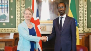 Ethiopian Foreign Minister Gedion Timothewos shaking hands with UK Foreign Secretary Yvette Cooper