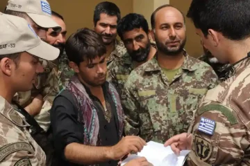 Greek advisers of the NATO Training Mission-Afghanistan teaching Afghan trainees at the Kabul Military Training Centre