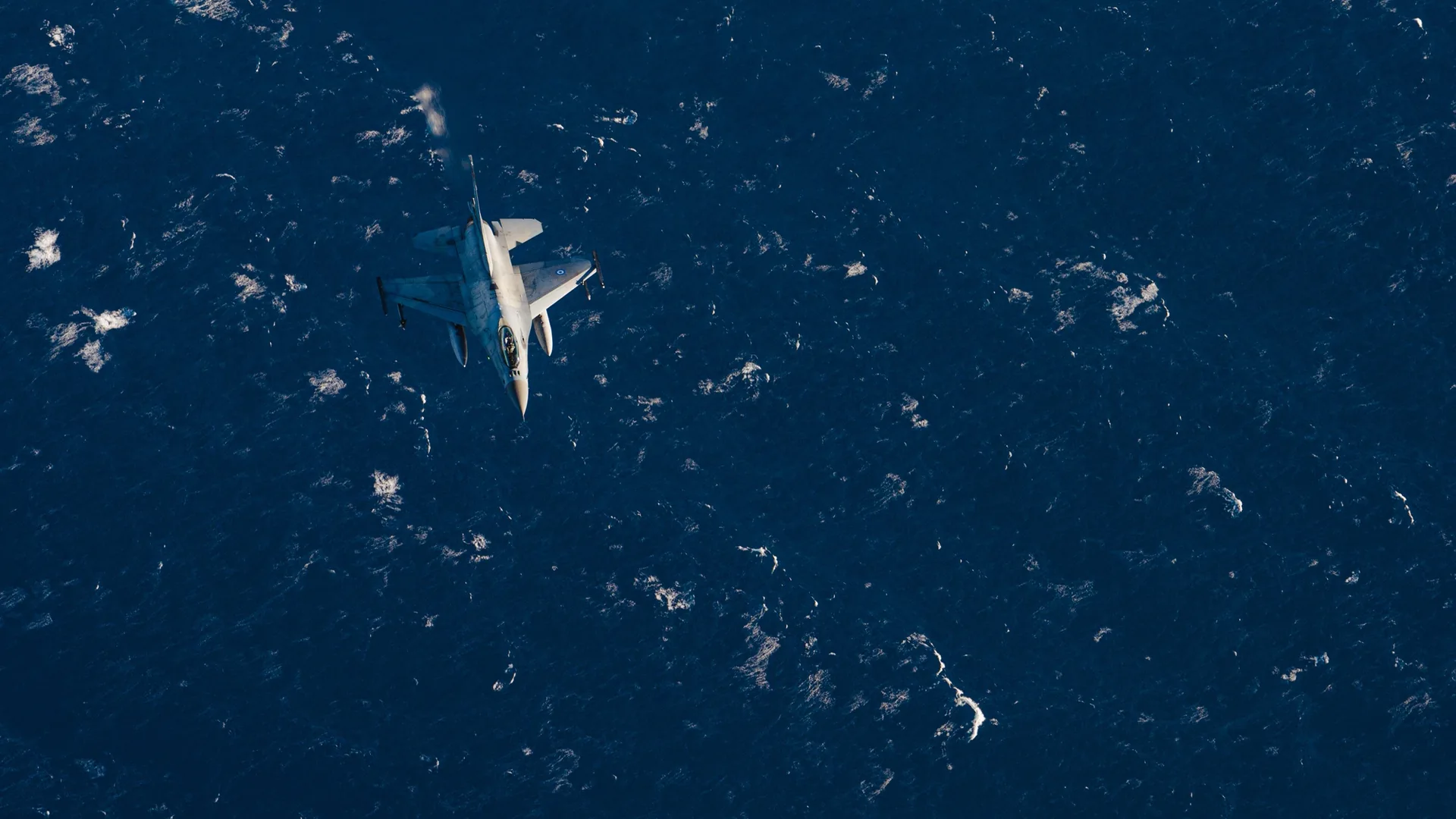 Hellenic Air Force F-16 flying over the Ionian Sea during Neptune Strike training in February 2022