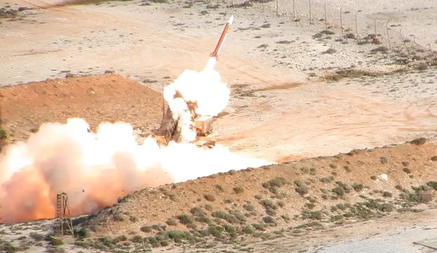 A Patriot missile leaving its launcher in a cloud of fire and smoke during a firing by the Hellenic Air Force