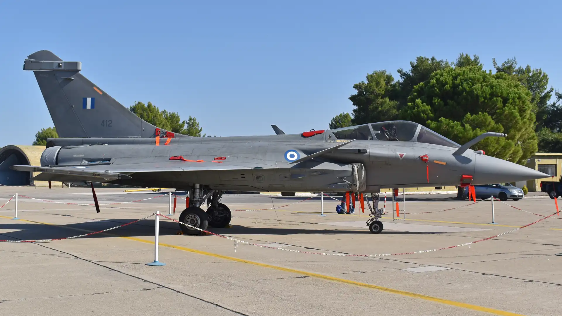 A Hellenic Air Force Rafale EG with serial 412 on a concrete apron, with Greek roundels and tail flag