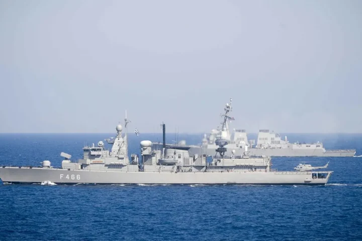 The Hellenic Navy frigate Nikiforos Fokas at sea in the Mediterranean with the US destroyer Winston S. Churchill in the background