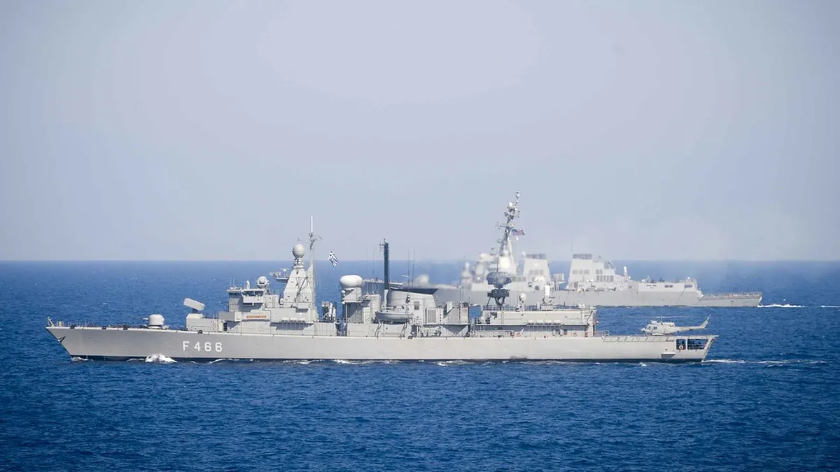 The Hellenic Navy frigate Nikiforos Fokas at sea in the Mediterranean with the US destroyer Winston S. Churchill in the background