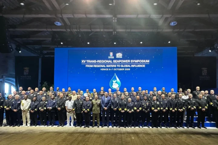 Navy chiefs and delegates in a group photo in front of a screen reading XV Trans-Regional Seapower Symposium, Venice 6-7 October 2026
