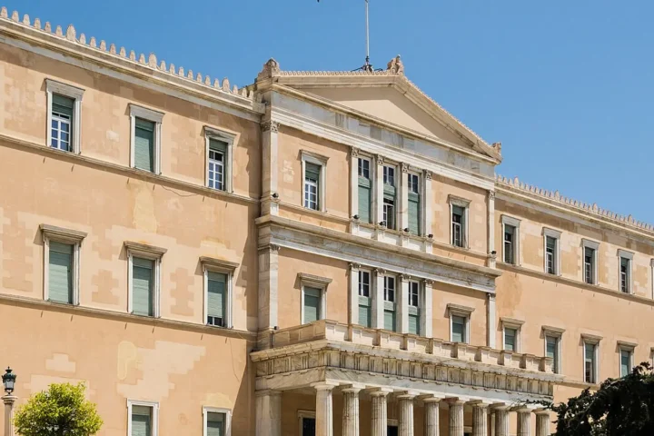The main facade of the Hellenic Parliament building in Syntagma Square, Athens