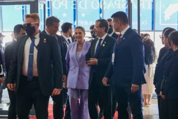 Israeli President Isaac Herzog and his wife Michal walking through a crowded entrance hall at a 2026 event in Costa Rica