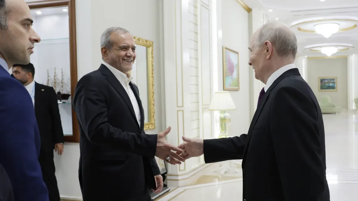 Iranian President Masoud Pezeshkian greeting Vladimir Putin in Turkmenistan