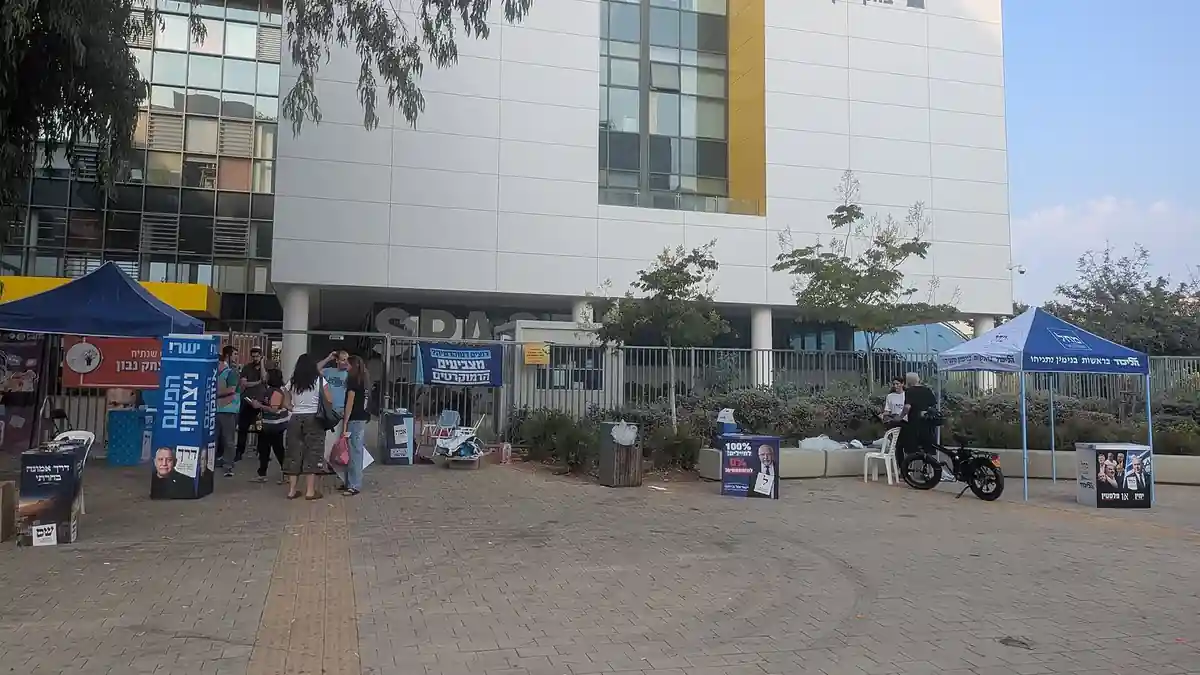 Party stands outside a polling station in Rishon LeZion