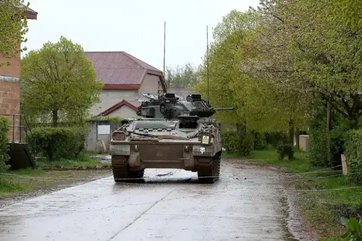 A British Warrior infantry fighting vehicle during a Joint Expeditionary Force live exercise on Salisbury Plain
