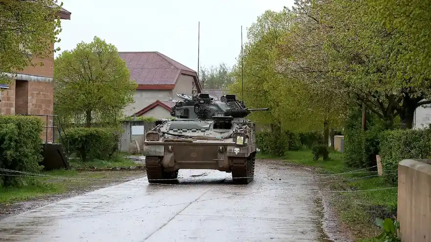 A British Warrior infantry fighting vehicle during a Joint Expeditionary Force live exercise on Salisbury Plain