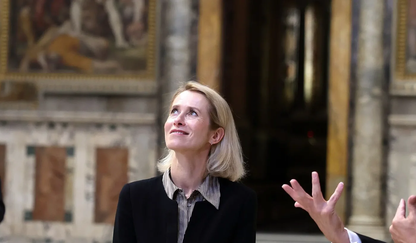 Kaja Kallas looking upwards inside a marble-floored hall of the Vatican