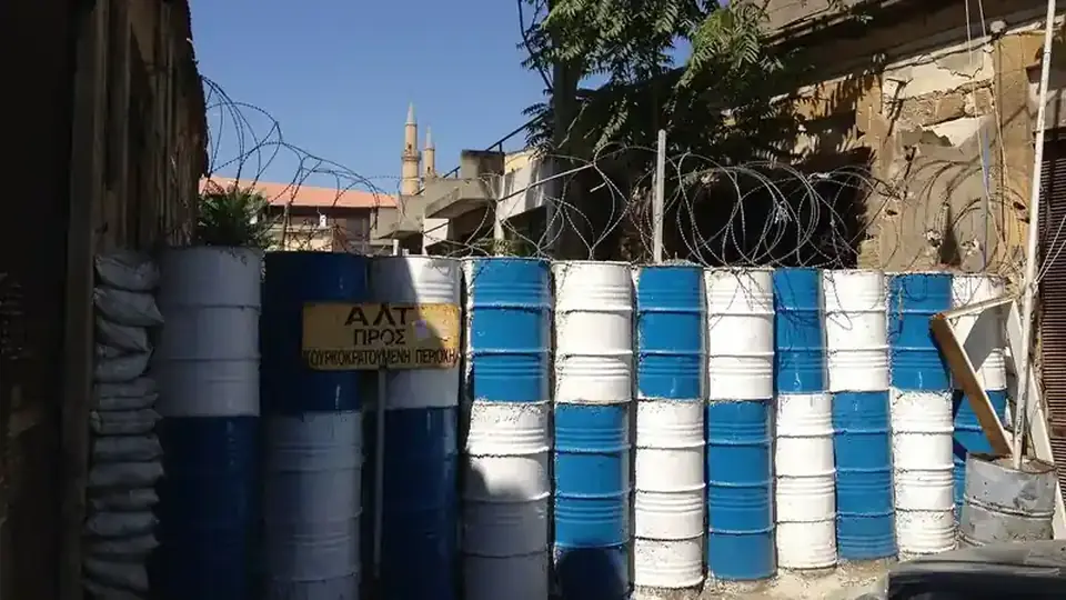 Barrels and barbed wire in the UN buffer zone in the old city of Nicosia