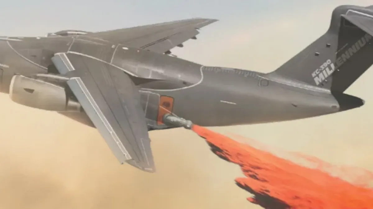 The KC-390 dropping fire retardant with its removable firefighting system