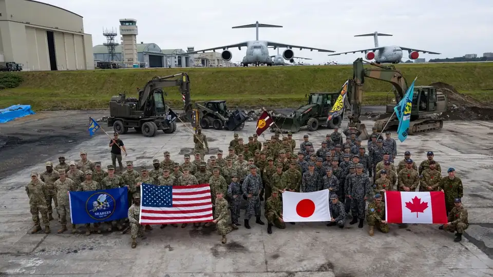 U.S., Japanese and Canadian service members pose for a group photo at Iruma Air Base during Exercise Keen Sword 27