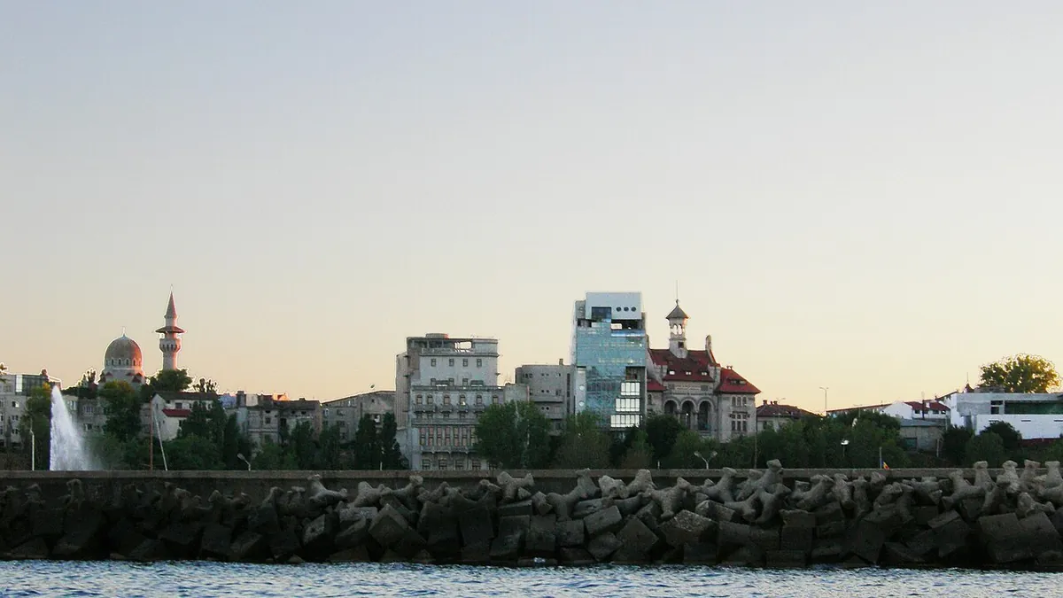 The waterfront of Constanța, Romania, seen from the sea across the breakwater