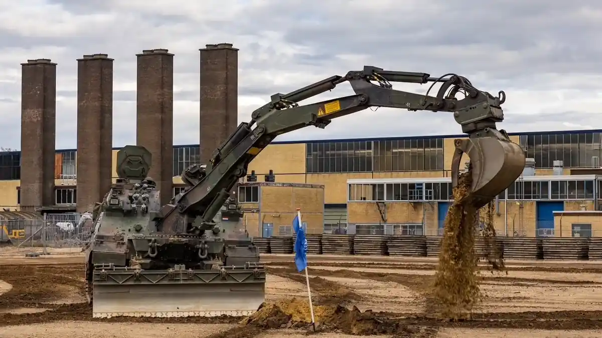 A Dutch Army Kodiak digging with its excavator arm at Leusderheide