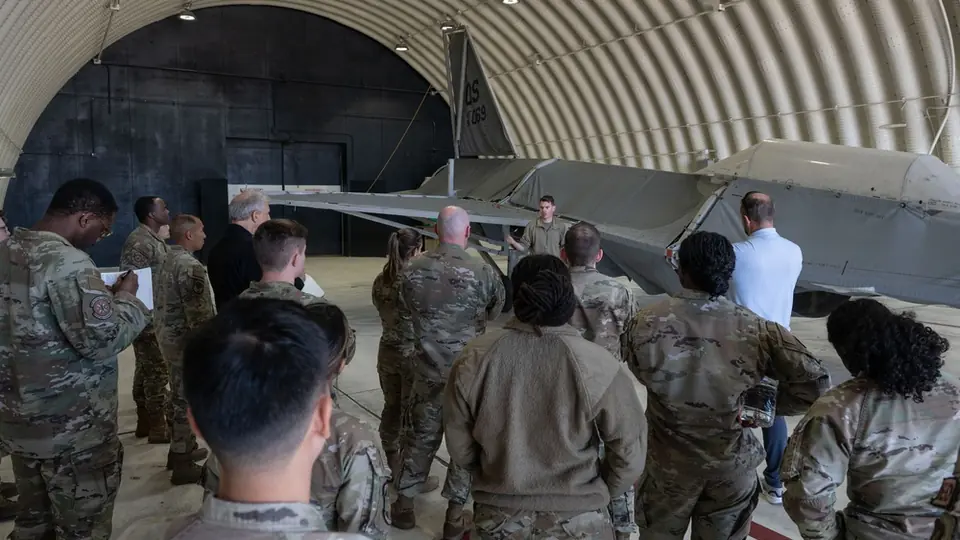 A U.S. Air Force emergency management specialist briefs Airmen on electronic personal dosimeters at Kunsan Air Base during exercise Radiant Falcon